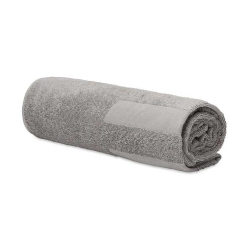 Domborszövött, 350 g/m² pamut strandtörölköző.  