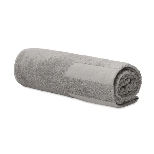 Domborszövött, 350 g/m² pamut strandtörölköző.  